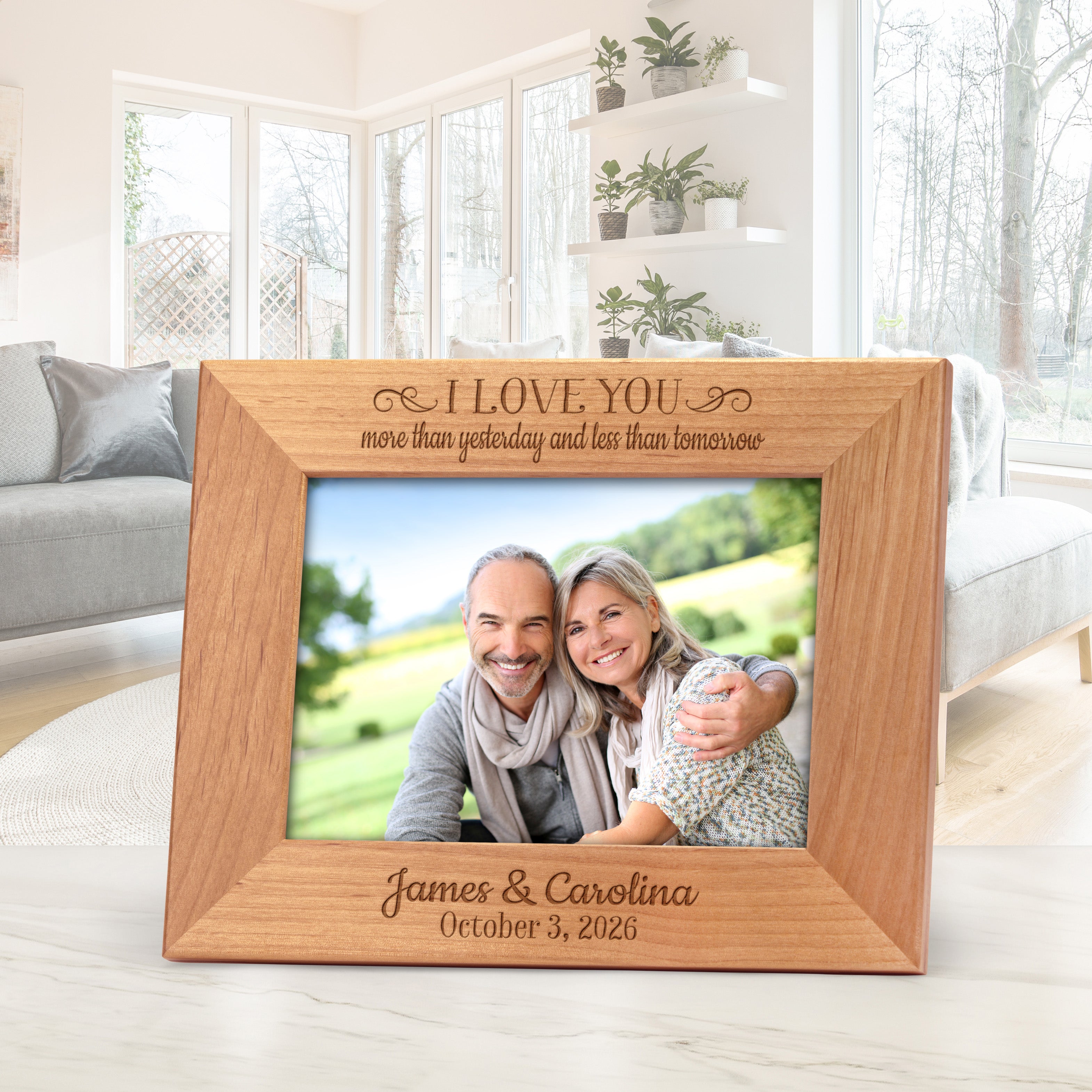 Wedding anniversary photo frame personalized with a couple's names and date.