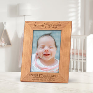 Baby picture frame engraved with the words, "love at first sight"
