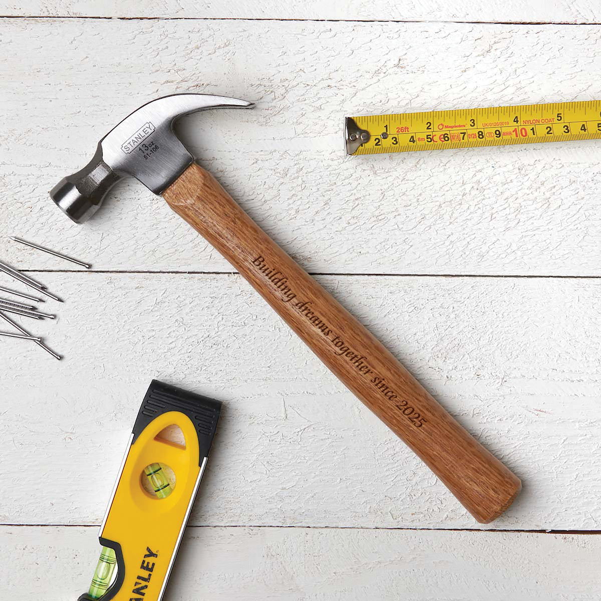 Anniversary hammer engraved with phrase "building dreams together"