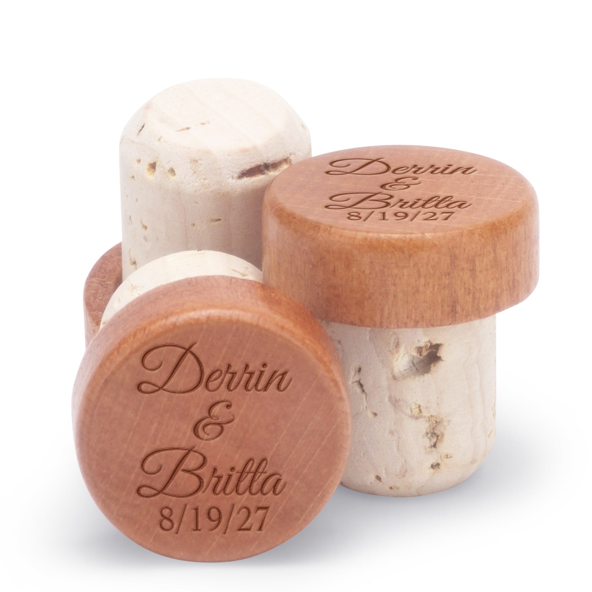Personalized champagne stoppers engraved with names and date.