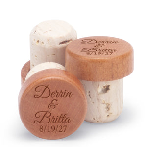 Personalized champagne stoppers engraved with names and date.