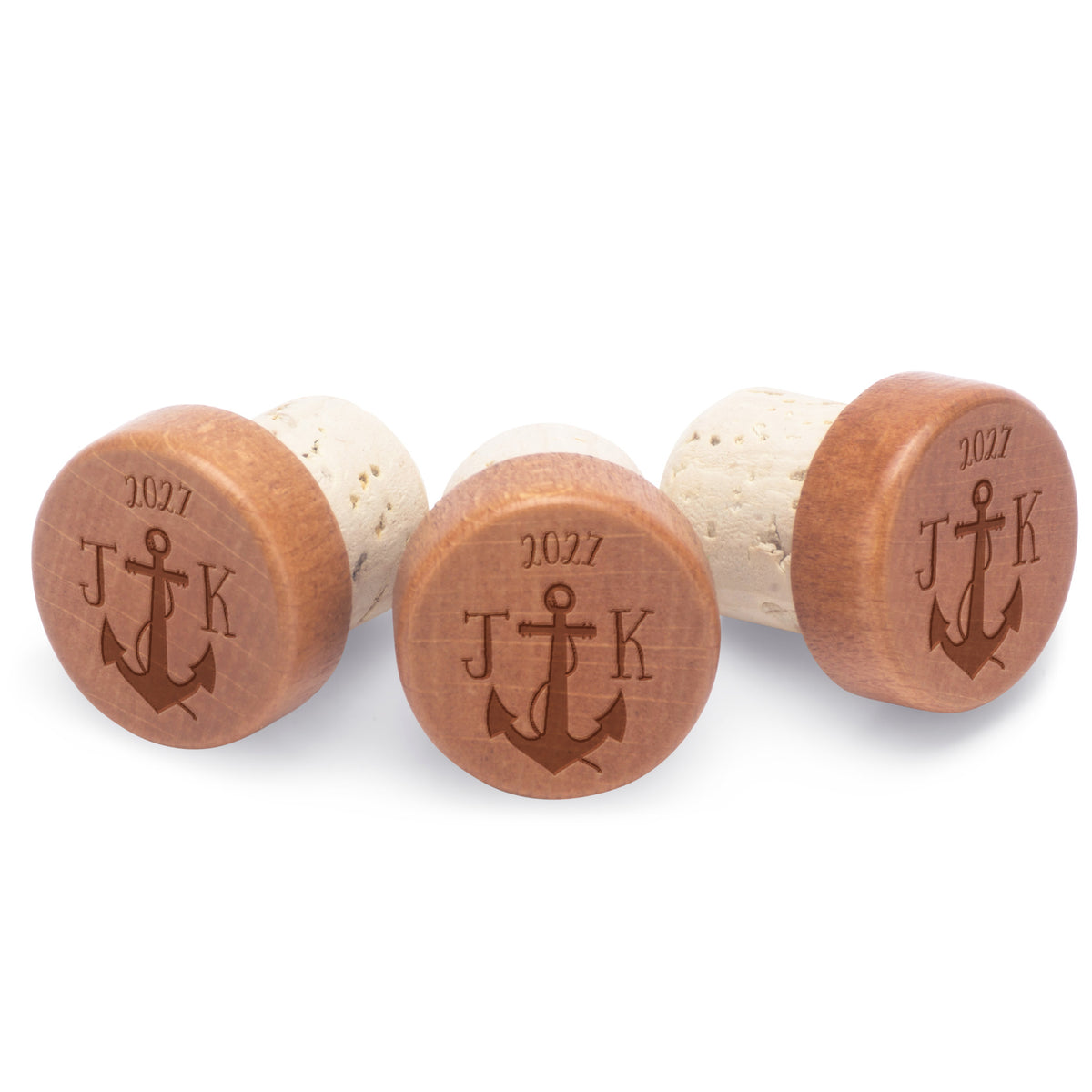 Custom bottle stoppers engraved with initials and year.